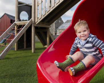 The Olde House has a large outdoor play area for young guests. James Ram