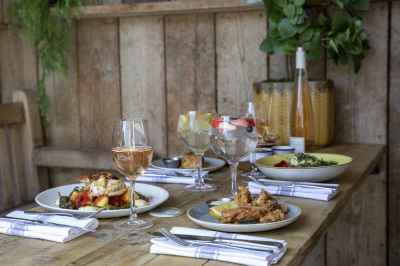 Food and drink on a table in the garden at The Latchmere
